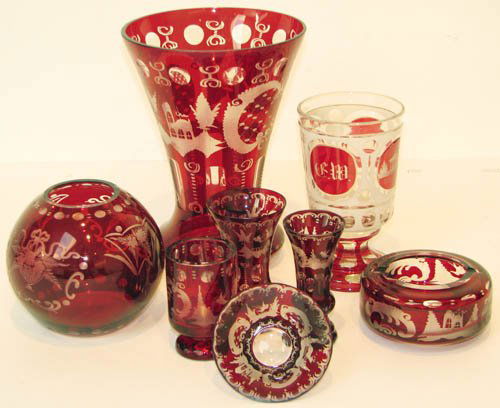 8 - Assorted Bohemian Ruby Glassware Vessels: Title: 3 asst. vases, 2 goblets, small glass & lidded condiment jar Medium: glass Dimensions: 8x6x6, 6x3 3/8 x 3 3/8, 5 1/2 x 4 1/2 x 4 1/2, 3 3/4x 1 3/4 x 1 3/4, 3 1/2 x 2 3/8 x 2 3/8,3 x 2 x 2, 7 x