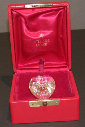 Steuben Glass Cut Heart with Teardrop Pendant Neck: Artist: Hilton, Eric for Steuben Title: Cut Heart with Teardrop Pendant, Model #1035, Steuben lead crystal pendant, heart form set in 18K yellow gold bezel with bail, 2"l. with heart-shape bubble in c
