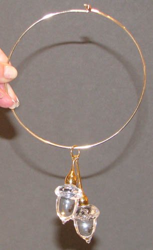 Steuben Glass Acorns Pendant Necklace by Schulze: Artist: Schulze, Paul for Steuben Title: Acorns Pendant Necklace, Model #1062 Date: 1968 Medium: Steuben Glass and 18k gold Dimensions: Acorn size: 3 x 1 x 1 inches Description: Simple ye