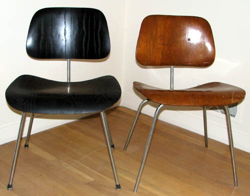 Pair of Eames DCM Chairs: Artist: Eames, Ray and Charles for Herman Miller Title: Pair of DCM chairs Medium: wood Dimensions: 30 x 19.5 x 17 inches Signature: Label for Hendejon Furniture in Pittsburgh on underside of brown
