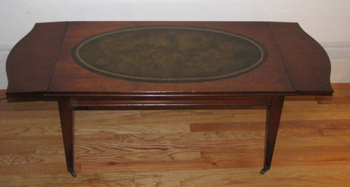 Leather Top Mahogany Coffee Table: Title:Leather Top Mahogany Coffee Table with hinge top sides Medium:mahogany Dimensions:16 x 20 x 48 inches (fully extended)