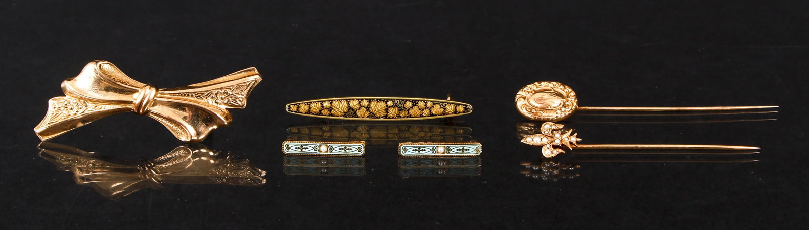 Group of 6 Antique Gold Pins: Group of 6 antique gold pins: 1 and 2: Pair of matching 14K yellow gold, enamel and pearl lingerie pins. Robins egg blue enamel adorns the intricately patterned gold surface. A single seed pearl is se