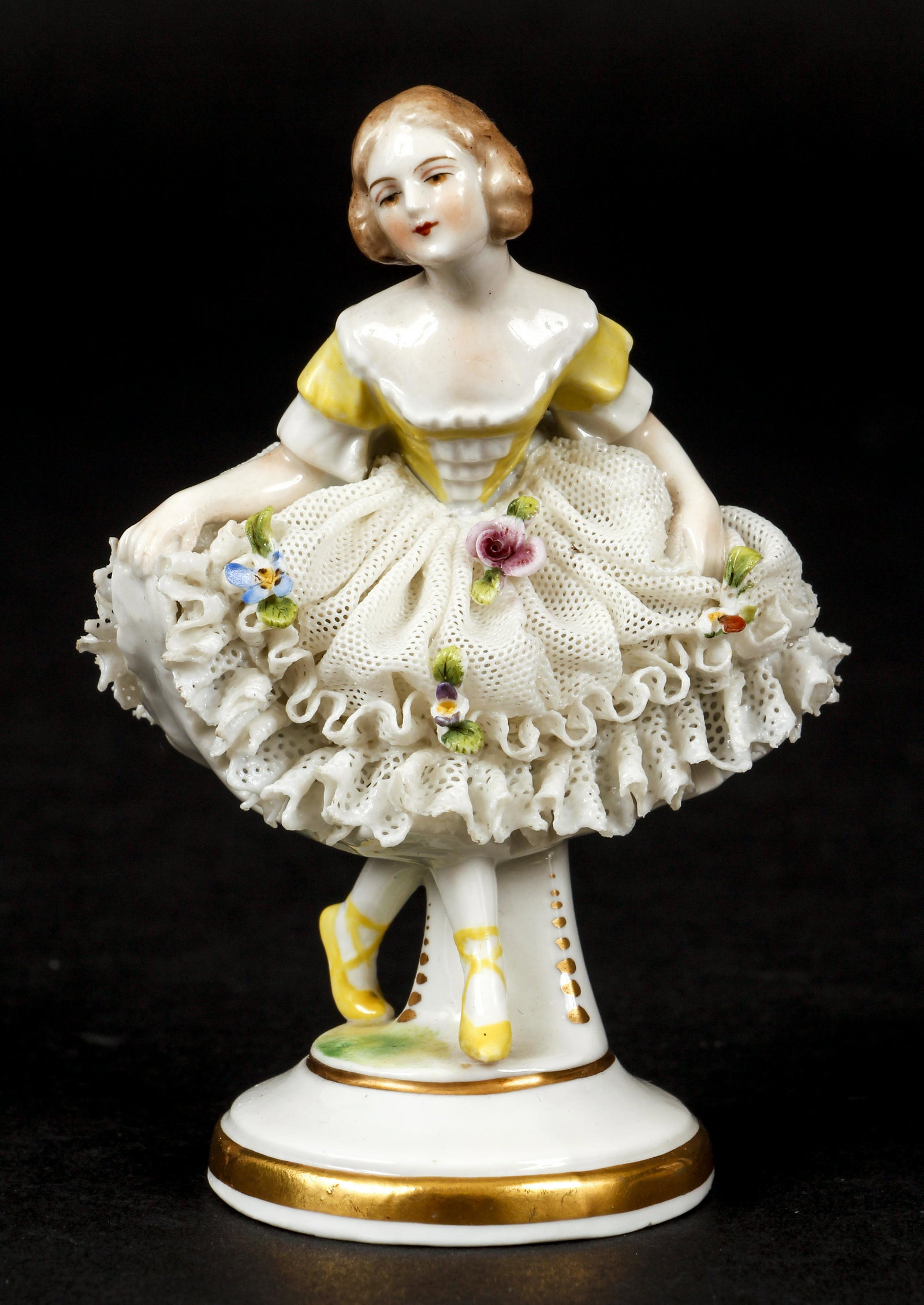 Vintage Volkstedt German Style Porcelain Ballerina: Vintage Volkstedt German Style Porcelain Ballerina with ruffled lace and flower, height 4 inches, marked on base in blue with a crown and what looks like the letter M.