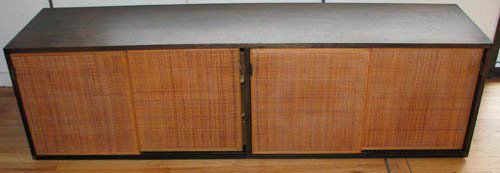 Florence Knoll Office Wall Hanging Cabinet: Artist: Knoll, Florence Title: Wall Hanging Office Cabinet with 3 drawers on left side, 3 adjustable shelves on the right side, cane doors, leather pulls Medium: wood and cane doors, leather pulls