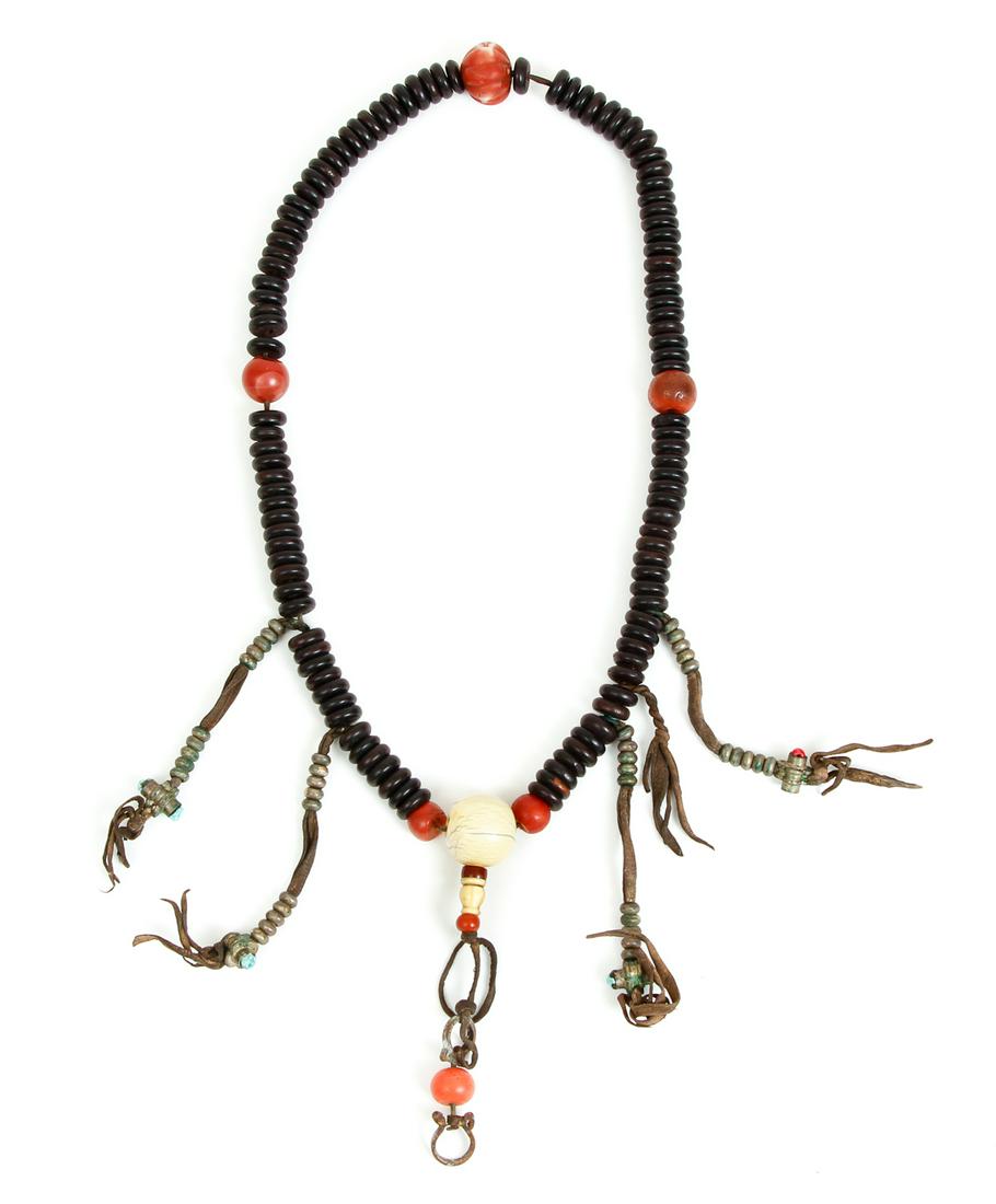 Tibetan Mala Recitation Beads Silver Coral: Tibetan Mala Recitation Beads, wood with accents in silver, coral, turquoise, leather, brass and bone, 19th century, 30 inches.