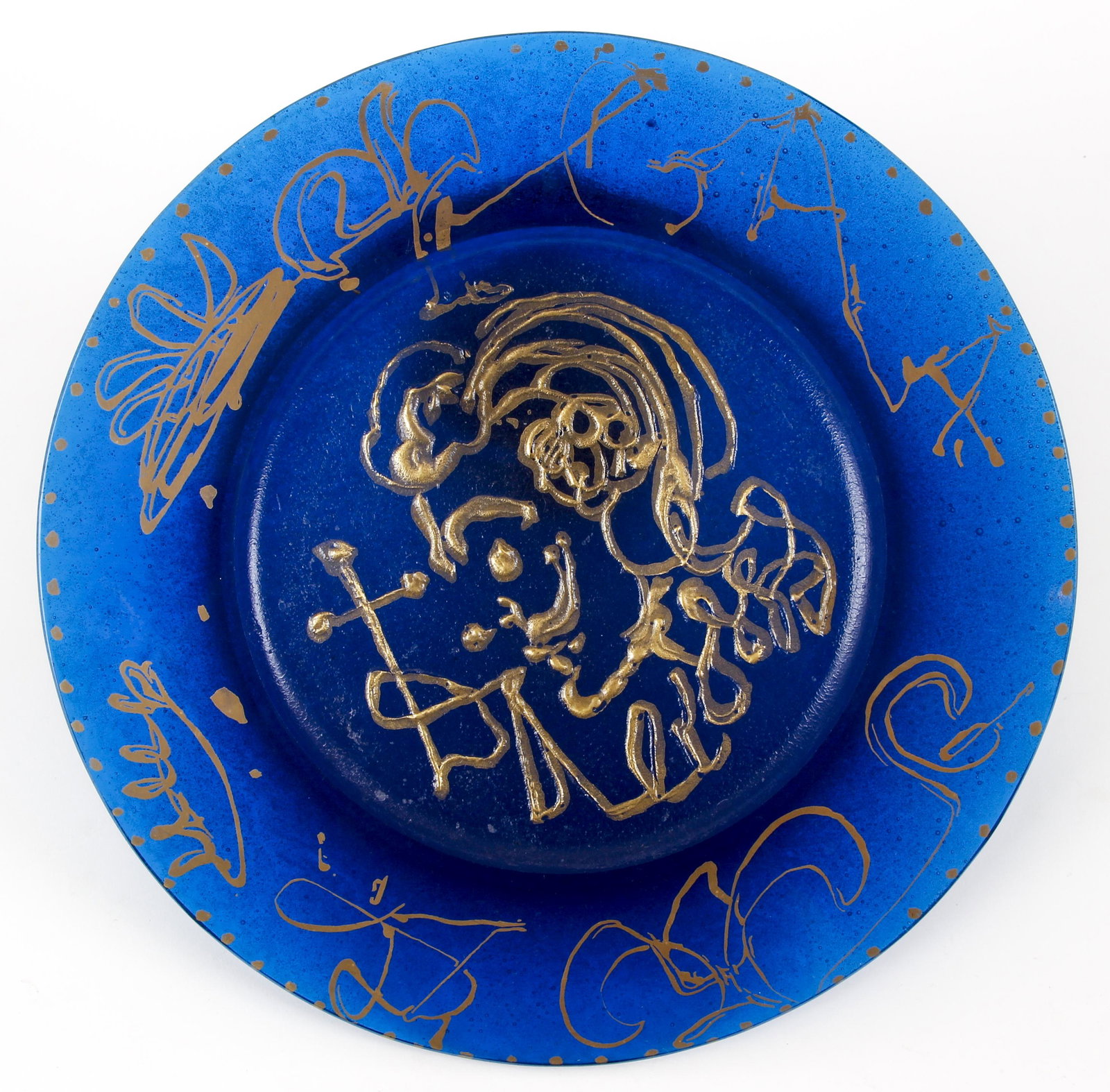 Salvador Dali Triomphale Pate-de-Verre Plate 1/2000: Dali, after Salvador, Triomphale Plate, blue pate-de-verre with gold embellishments, 1970, limited edition with 1464/2000 etched on rim of underside, Made in France, diameter 10.5 inches. Provenance: 