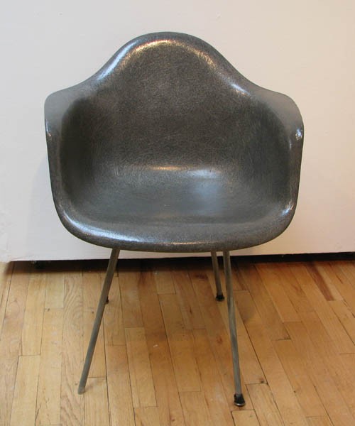 Eames Shell Chair in Grey: Artist: Eames, Charles and Ray for Herman Miller Title: Grey Shell Chair Medium: fiberglass Dimensions: 31 x 27 x 25 inches Signature: Eames for Herman Miller red paper label on underside