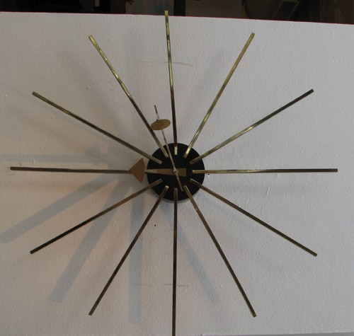 George Nelson & Associates Metal Spoke wall clock: Artist: Nelson, George for Howard Miller Title: Spoke Wall Clock Date: c. 1955 Medium: brass, enameled metal Dimensions: 24 x 24 x 3 inches
