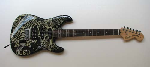 Squier OBEY Graphic Stratocaster HSS Dissent signe: Artist: Fairey, Shepard (American, b. 1970) Title: Squier OBEY Graphic Stratocaster HSS Dissent signed by Shepard Fairey Medium: electric guitar Dimensions: 40 x 11 x 2.5 inches Signature: signed Shep