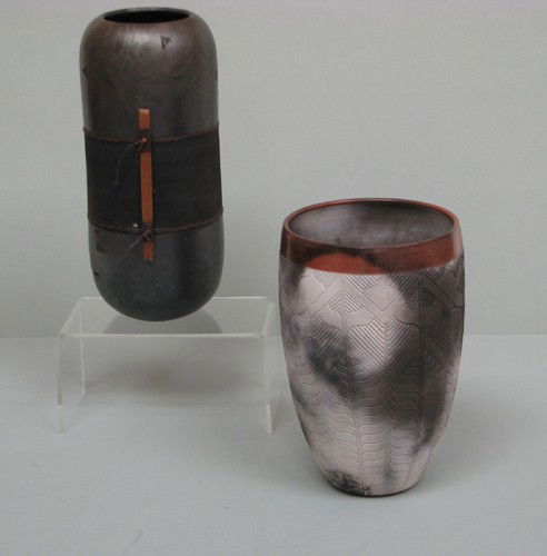 Two Raku Ceramic Vessels: Nancy Meeker and Dewit: Artist: Meeker, Nancy; Dewit Title: Vase with Incised decoration; Vase with Twine and Wood embellishment Medium: raku ceramics Dimensions: 9.5 x 6 inches; 11.5 x 4.5 inches Signature: Incised with sig