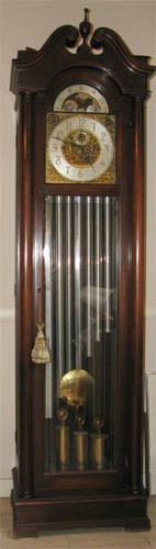 American Tall Case Clock: Artist: HWN Title: American Tall Case Clock, possibly Herschede Medium: mahogany with glass front Dimensions: 82 x 20 x 16 inches Signature: incised with HWN on clock face Provenance: The Estat