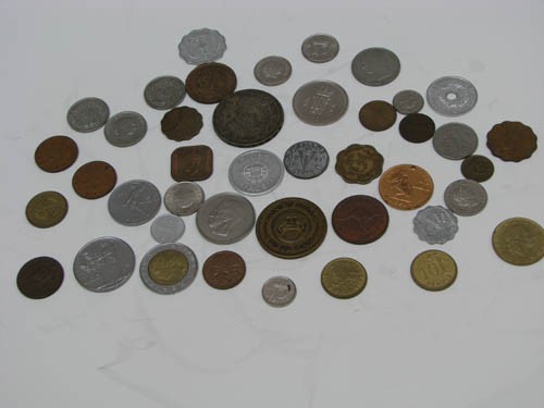 Lot of Assorted Traveler's Pocket Change: Lot of Assorted Traveler's Pocket Change including wartime Canadian Nickel Medium: coins Dimensions: various Provenance: The Estate of Arnold D. and Norma W. Wilner