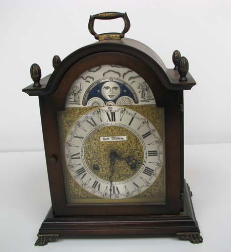 Seth Thomas lunar mantle clock: Artist: Seth Thomas Title: Seth Thomas lunar mantle clock Medium: wood Dimensions: 11.5 x 9 x 6 inches Description: This clock is an 8 - day key wound mantel clock and the original key is included. It