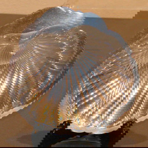 Sterling Silver Shell Dish: Sterling Silver Shell Dish, ends on ball feet Medium: sterling Dimensions: 3 oz, 1.25 x 5.25 x 5.25 inches Provenance: The Estate of Arnold D. and Norma W. Wilner