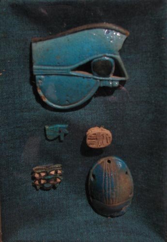Egyptian scarab, scaraboid, Horus amulet, and othe: Steatite & Faience contained in a shadow box Medium: carved stone and other materials Dimensions: 3 x 2.5 x 3/8 inches (The largest object) Provenance: Estate of Diana Caplan, Pittsburgh, Pa. Frame Ty