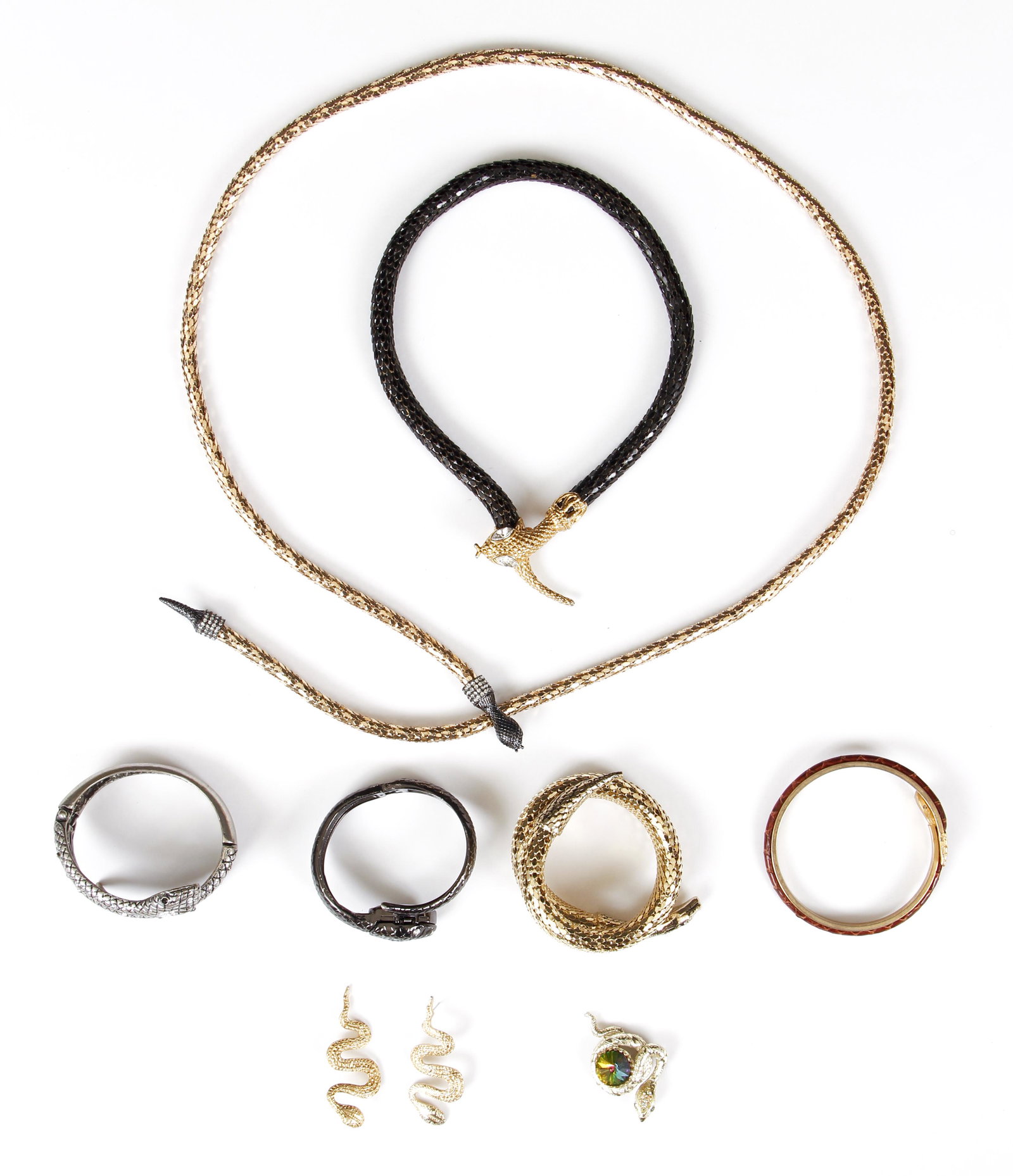 Assorted Costume Snake Jewelry: Assorted costume snake jewelry. Lot includes gold mesh belt with rhinestone black metal clip back head and tail. 39" long. Black mesh necklace with gold metal head and tail, rhinestone eyes. 19" long.