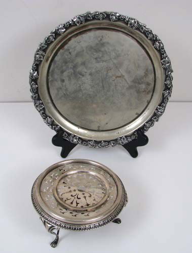 Silver plate tray, sterling trivet: Title: Silver plate tray, circular shape with a scallop grape and leaf rim, monogrammed interior (plate worn); Silver bright etched trivet Medium: silverplate/sterling Dimension: sterling weight 9.090