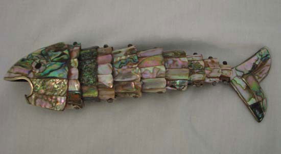 Sectional abalone fish Bottle Opener: Title: abalone fish Bottle Opener Medium: abalone Dimension: 8 x 2 inches Provenance:The Estate of Emily F. Oliver, Sewickley, PA