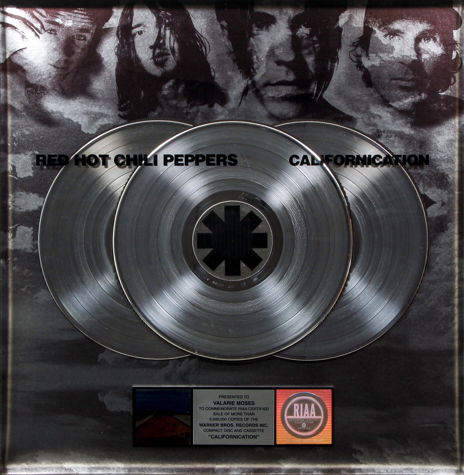 Red Hot Chili Peppers Californication Platinum Plaque: Red Hot Chili Peppers Multi-Platinum Record plaque for their 1999 album Californication, certified sales award from the RIAA, presented to a Warner Brothers Records Promotions executive, in a frame 26