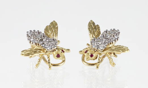 18K Diamond Ruby Bee Clip Earrings: 18K yellow gold diamond and ruby bee clip back earrings by Harry Rosenthal. The cast figural bee is intricately engraved, the back of the bee is bead set with 1 carat of round cut diamonds, faceted ru