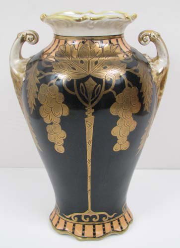 Noritake gilded Vase with hanging grapes: Artist: Noritake Ceramic Company Title: Classical Vase Medium: glazed ceramic with gilding Dimensions: 10.75 inches tall Signature: with stamp underneath