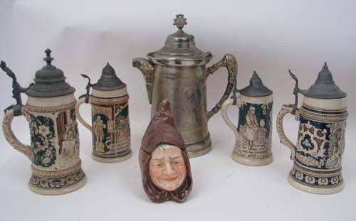 Four vintage beer steins with pitcher and jug: Title: Four vintage beer steins stamped Heidelberg on bottom of one. One metal beer pitcher stamped M.B. Benedict Quadruple plate 583. One figural mug after Royal Doulton. Medium: ceramic, metal Dimen