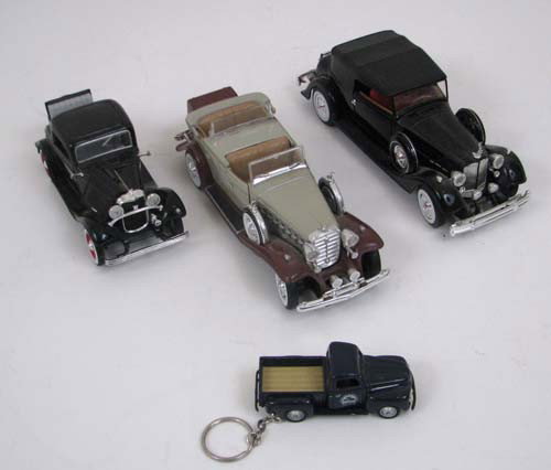 Three model cars with one keychain truck: Artist: Anson Title: Three model cars made by Anson in China,1934 Packard, Cadillac 1932 Phaeton V16 and 1932 Ford 3 Window Coupe. The Packard and Cadillac feature working steering, all three have doo