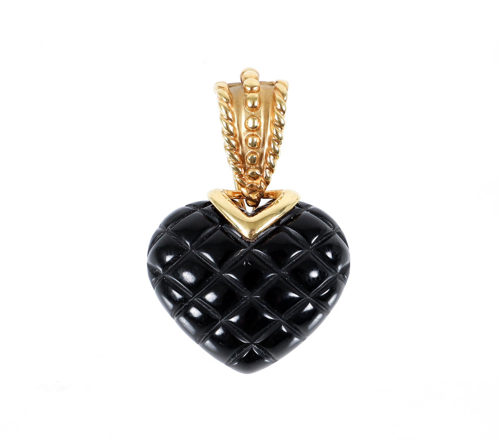 14K Carved Onyx Heart Pendant: 14K yellow gold carved onyx heart pendant. The pillow engraved heart pendant is topped with a milgrain decorated bail. Measures 1 1/2" in length, 1" wide. Finished with a hinged clip and pin back. Mar