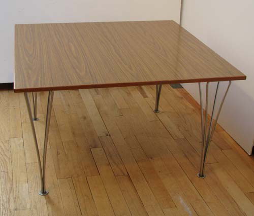 Piet Hein Mid Century Modern Coffee Table: Artist: Hein, Piet Title: Coffee Table with Walnut Laminate Top and Aluminum Legs Medium: walnut veneer and aluminum Dimensions: 18.5 x 31.5 x 31.5 inches