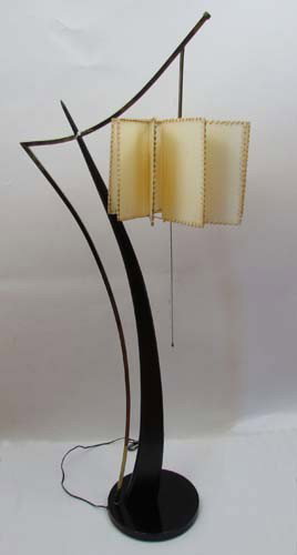 1950's retro lamp: Title: 1950's retro lamp with paddlewheel shade Medium: brass, laminate and stitched parchment shade Dimensions: 61 inches tall