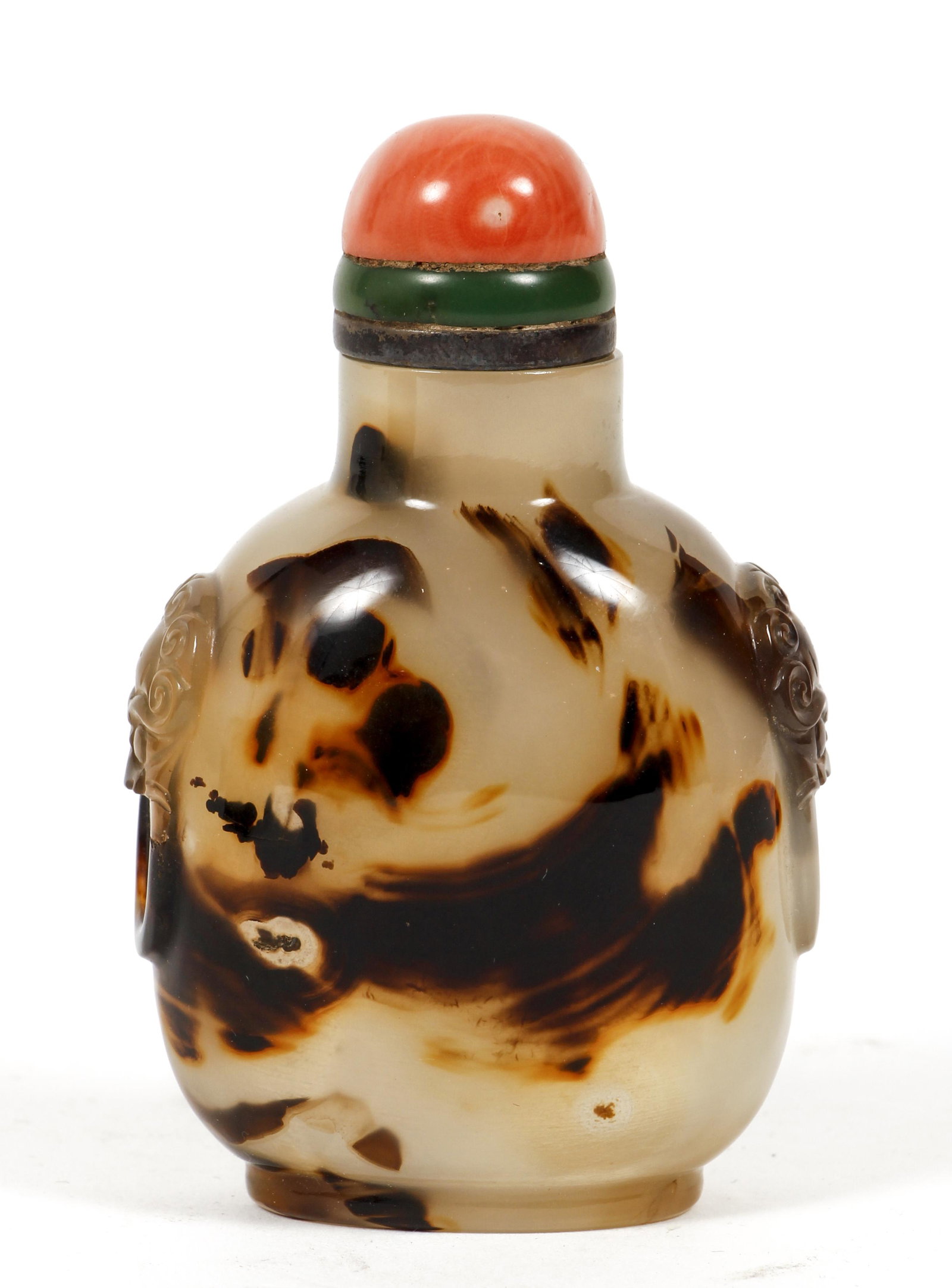 Chinese Mottled Glass Snuff Bottle: Chinese Mottled glass Snuff Bottle with faux dragon handles on sides and coral top and metal spoon, indistinguishable marks to spoon, 3.25 inches long. Provenance: The Estate of Bernard Olsacick. Cont