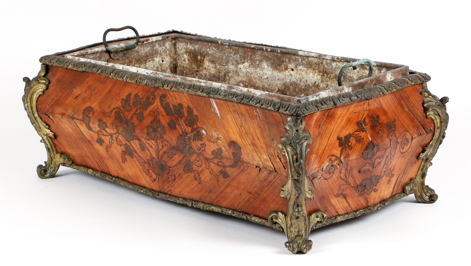Regence style marquetry inlaid Bombe French Jardiniere: Regence style inlay measuring 8.5 x 23.5 x 14 inches, with metal liner and ormolu fittings.