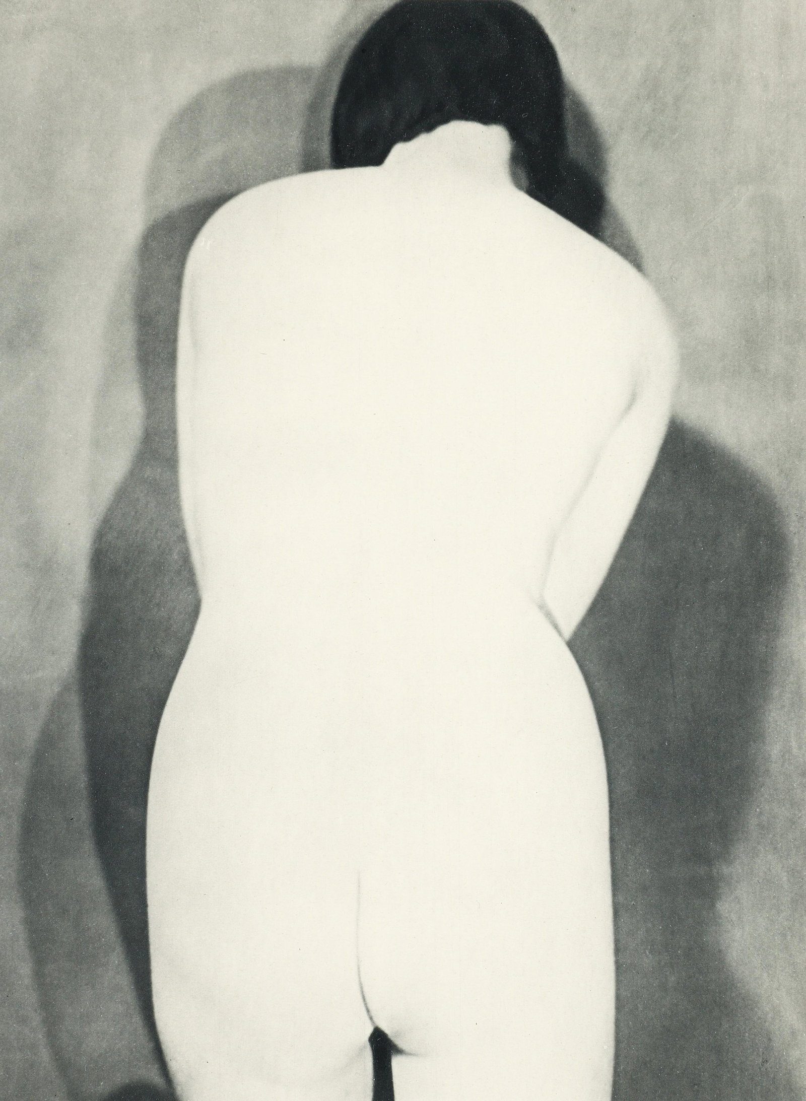 Man Ray Untitled Nude with Back turned 1934 Heliogravure: Man Ray (French/American, 1890-1976), Untitled Female Nude with Back Turned, 1934, heliogravure on paper, printed by Neogravure of France, image 11 x 8.5 inches, full sheet 12.25 x 9.5 inches, matted 