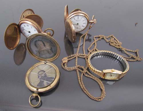 2 ladies pocket watches, with locket, and wrist wa: Artist: American, Waltham, and Pulsar wrist watch Date: one pocket watch engraved 1893 Medium: gold plate Dimensions: 1.5 inch diameter and smaller Description: two ladies engraved pocket watches, one