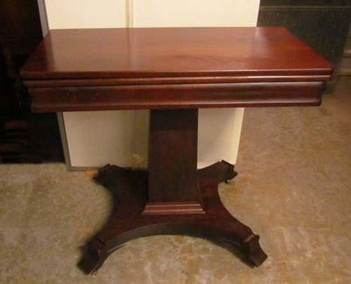 Mahogany Card table in Second Empire Style: Title: Card Table in Mahogany with fold top square pedestal on flat platform with scrolled flat feet Date: circa 1910 Medium: mahogany Dimensions: 28.5 x 33 x 33.25 inches Provenance: Mrs. Jane Dunla
