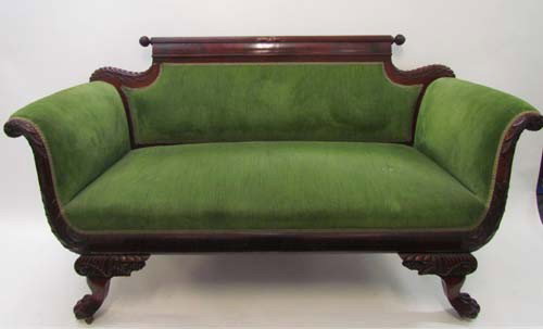 Period Empire mahogany upholstered loveseat: Title: Loveseat with green upholstery nicely carved paw feet and acanthus carved knees, exposed wood frame with reeded crest rail missing finial on one side Date: circa 1840 Medium: mahogany with gree