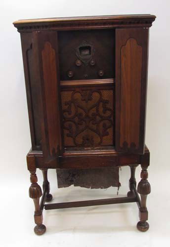 1924 Edison Console Radio: Title: Edison Console Radio with mahogany cabinet with linen fold doors on William and Mary style base Date: 1924 Medium: walnut Dimensions: 47.5 x 26.5 x 16.5 inches Provenance: Mrs. Jane Dunlop Peti