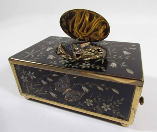 Metal and Enamel Music Box: Title: Ornate, French Style enamel music box with bird decoration Medium: metal, enamel Dimensions: 1.75 x 3.7 x 2.5 inches