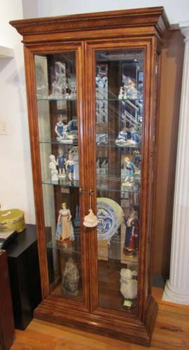 Glass Display Case: Artist: American Furniture Company Title: Glass Display Case with lighting, mirror back (objects not included) Medium: walnut Dimensions: 78 x 13.75 x 32.75 inches