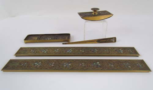 Tiffany Studios Bronze Partial Desk Set in Abalone: Title: includes Letter file, blotter ends, pen tray, rocker blotter Description: PART FROM one abalone disk is missing Signature: each stamped TIFFANY STUDIOS NEW YORK and numbered 1152