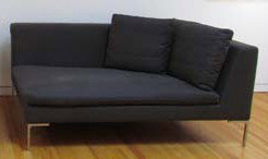 Dark Grey B&B Italia Loveseat sofa: Artist: B&B Italia Title: B&B Italia Loveseat sofa with dark grey upholstery Medium: upholstery, chrome Dimensions: 28 x 61.5 x 37.5 inches Signature: Made in Italy, B&B Italia label on underside