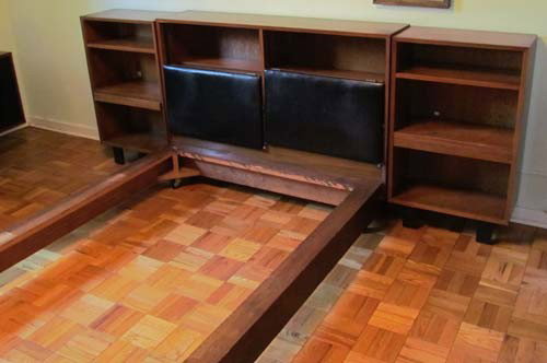 George Nelson Bed and Night Stand Bookshelves: Artist: Nelson, George for Herman Miller Title: Bed with leather adjustable headboards (storage behind) on castors and pair of night stand book shelves with pull out stand under second shelf Medium: w
