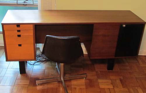 George Nelson Desk with Chrome Pulls, leather fron: Artist: Nelson, George for Herman Miller Title: Desk with Chrome Pulls, leather front cabinet, modern chair included in lot Medium: walnut, leather Dimensions: 29.5 x 67.5 x 18.5 inches Signature: Geo