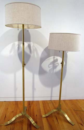 Pair of Modern Brass Floor lamps: Title: Pair of Modern Brass Floor lamps with beige linen shades Dimensions: 60 inches tall, 50 inches tall