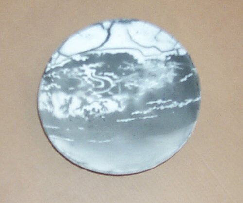 Caplan, Jerry: Caplan, Jerry Grey and White bowl on three legs, 1977 Media: Ceramic done using Smokeless Radu Technique Dimensions: 13 3/4 x 13 3/4 x 4 inches Signature: Incised on underside, Caplan 77 Condition: In