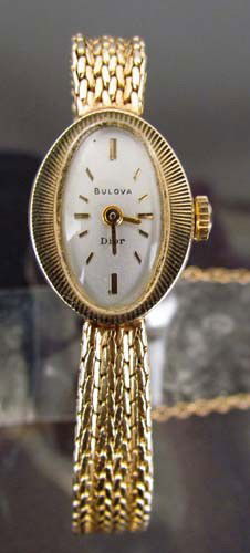Bulova Dior 14 K lady's wristwatch: Title: Vintage Dior for Bulova lady's wristwatch in 14 caret yellow gold with delicate interwoven band Dimensions: 520ozt Signature: 14k on clasp