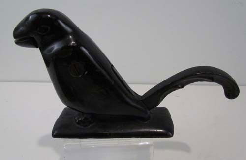 Cast iron bird nutcracker: Title: Black cast iron squirrel nutcracker Medium: cast iron Dimensions: 5.5 x 9 x 2.5 Description: primitive nut cracker in the form of a squirrel