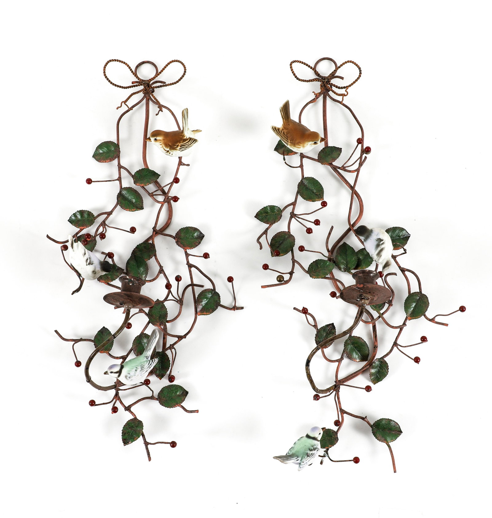 Pair of Painted Porcelain and Metal Bird Sconces: Pair of Birds in a Bush One Light Sconces, 20th century, painted porcelain birds on painted metal floral design with green leaves and red berries, 20 inches tall, approximately 9 to 10 inches wide, un