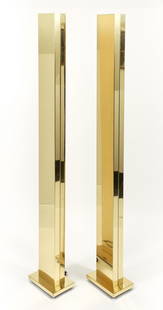 Pair of Casella brass Skyscraper floor lamps: Casella Lighting Company, polished brass floor lamps with halogen lamps emitting light from tops, skyscraper style, 72.75 inches