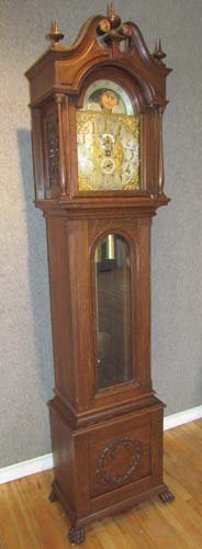 Tiffany & Co. American Classical revival Tall Oak C: Artist: Tiffany & Co. Case with Peerless Co. made in Germany 60867 clock works Title: American Classical Revival Tall Case Clock with Scrolled and pieced pediment, silvered and gilt dial marked "Tiffa